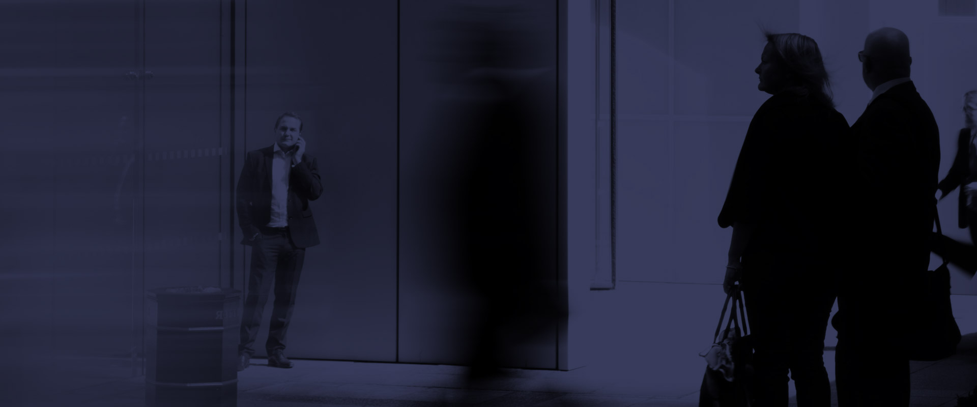 People Walking Towards Building Entrance